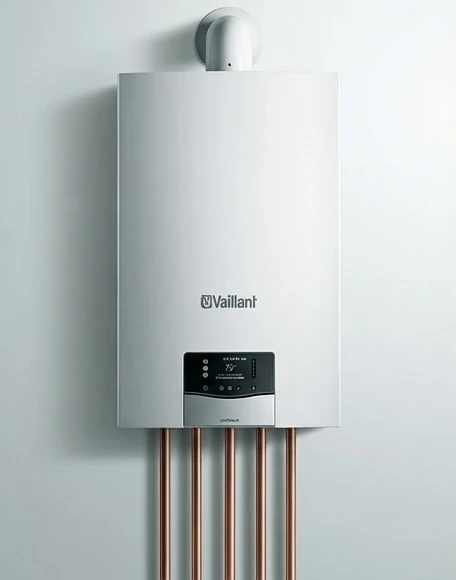 Wall-mounted gas boiler with copper pipework underneath